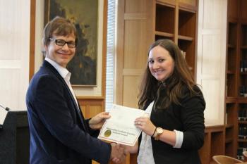 A grad student receives an award