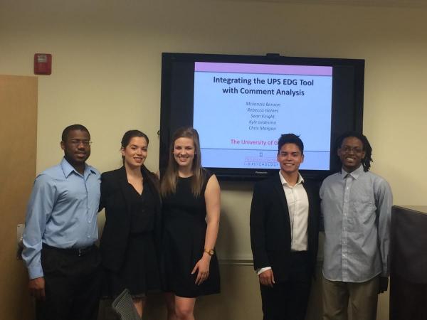 Undergraduate lab students present a project to UPS representatives