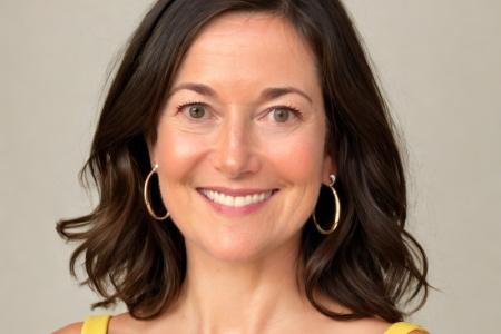 Photo of Becky Winkler wearing a yellow top and smiling
