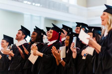 Iomp graduates clapping